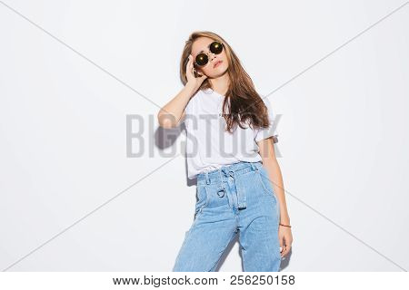 Sexy Woman In A White T-shirt On A Gray Background. Mock-up.