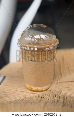 Caramel Macchiato Iced Coffee Put On Wooden Table