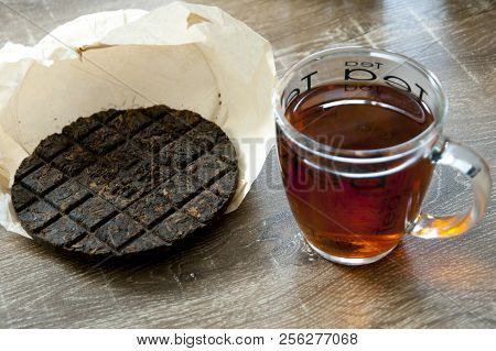 Organic Chinese Puer Tea On Wood Table