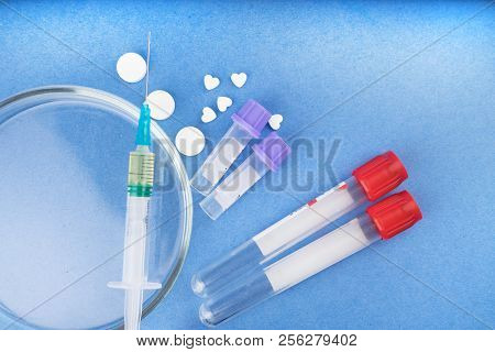 Medicines, Drugs, Doping, Test Tubes, Syringe, Petri Dish On A Blue Background.