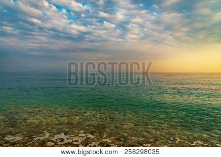 Ialisos Stone Beach And Sea On Sunset Time