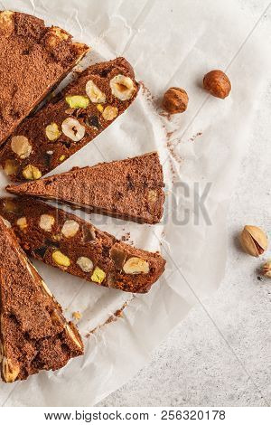 Italian Dessert Panforte With Nuts, Chocolate And Candied Fruits. White Background, Top View, Italia