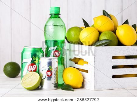 London, Uk - April 27, 2018: Plastic Bottle Of 7up Lemonade Soda Drink With Fresh Lemons And Limes.t