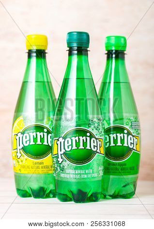 London, Uk - September 03, 2018: Bottles Of Perrier Sparkling Water On Wooden Background. Perrier Is