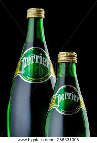 London, Uk - September 03, 2018: Bottles Of Perrier Sparkling Water On Black Background. Perrier Is 
