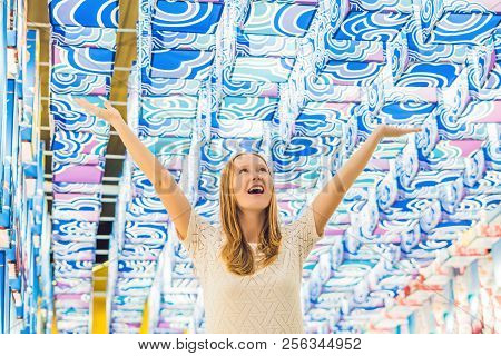 A Young European Woman In The Background Of Asian Lanterns Is Celebrating The Chinese New Year