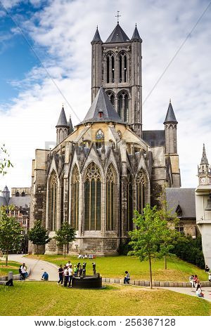 Ghent, Belgium - August 14, 2015 - The View Of The Saint Nicholas Church With People In The Historic