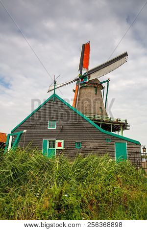 Traditional, Authentic Dutch Windmill In Zaanse Schans Village.