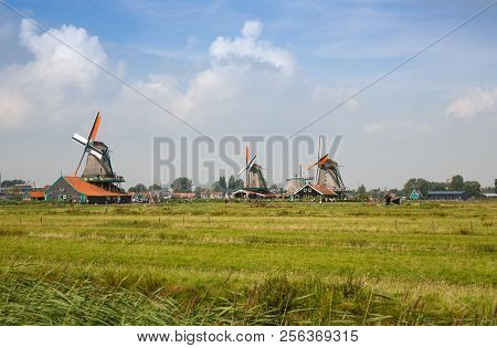Zaanse Schans, Netherlands, August 19, 2015 - Traditional, Authentic Dutch Windmills At The River Za