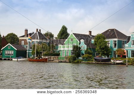 Traditional, Authentic Dutch Houses And Boats At The Canal.