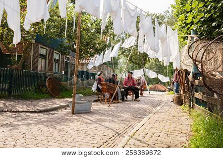 Enkhuizen, Netherlands - August 19, 2015 - The Inhabitants In The Traditional Clothes In Dutch Fishe