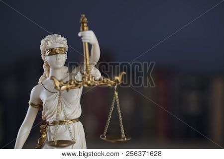 Attorney Office. Themis And Legal Books On Wooden Desk.