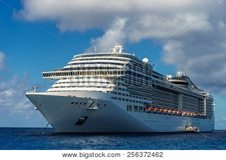 Cruise Ship In Crystal Blue Water With Blue Sky