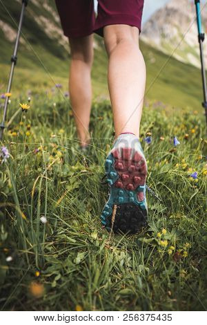 Adventurous Sportive Girl Hiking In Beautiful Alpine Mountains