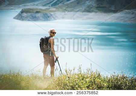 Adventurous Sportive Girl Hiking At A Lake In Beautiful Alpine Mountains
