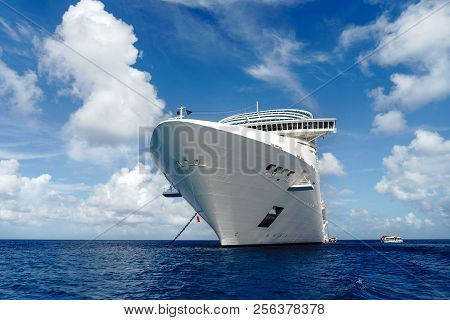 Cruise Ship In Crystal Blue Water With Blue Sky