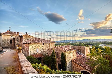 Tiled Roofs Of Houses And Sky With Clouds On The Background Of Mountains. Beautiful Scenic View Of B