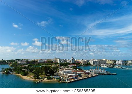 Scenic View Of Historic Colorful Puerto Rico City In Distance From The Sea With The Port In Foregrou