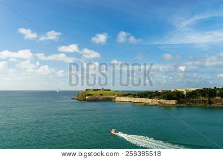 Scenic View Of Historic Colorful Puerto Rico City In Distance With Fort In Foreground