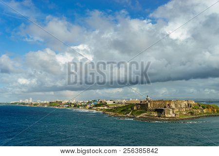 Scenic View Of Historic Colorful Puerto Rico City In Distance With Fort In Foreground