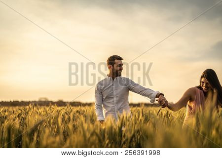 Romantic Couple on a Love Moment at gold wheat flied - Holambra, Sao Paulo, Brazil