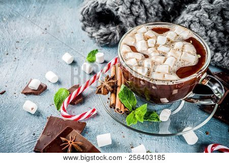 Homemade Hot Chocolate With Mint, Candy Cane And Marshmallow, Light Blue Background With Warm Blanke