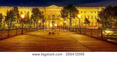 Panorama Of Institut De France With Bibliotheque Nazarine Illuminated By Night View From Pont Des Ar