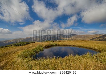Clear Lke, Clouds And Svydovets Ridge. Carpathians
