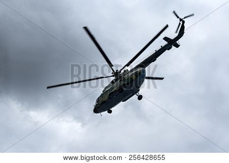 Helicopter Flyin In The Sky Against A Background Of Clouds, Screws, Paddles, Air Transport, Flight