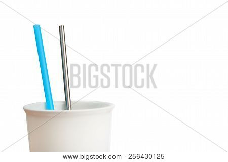 Reusable Stainless Steel Straw And Disposable Straw In A Cup, Isolated On White