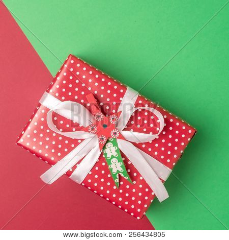 Christmas Present On A Red And Green Background Horizontal Copy Space Background With Gift Box Flat 