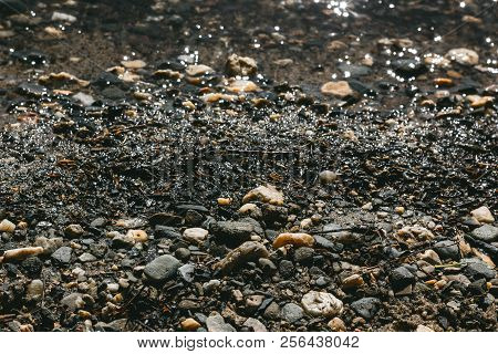 Stones Of Different Colors On The Seashore, Background Texture