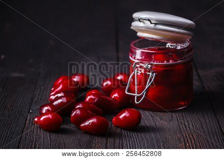Dogwood Cornel Berry Jam And Ripe Cornel Berries On Rural Wooden Background