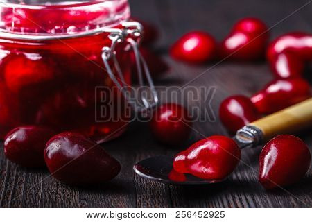 Dogwood Cornel Berry Jam And Ripe Cornel Berries On Rural Wooden Background