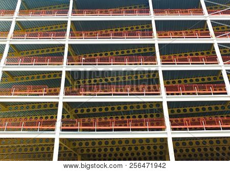 A Looking Upwards View Of Large Modern Commercial Building Under Construction With Steel Beams And Y