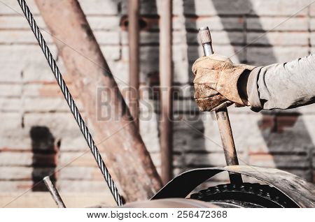 Worker Hand Pulling The Lever Of A Pile Driver (bate-estaca). Construction Worker. Hand Holding A Le