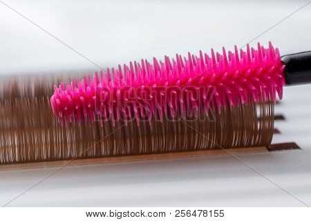 Eyelash Brown Extension Procedure. Set Lashes Close Up Pink Comb