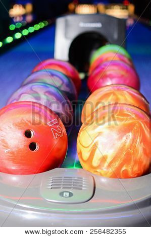 A Row Of Bowling Balls Close Up. Bowling Bowls Return System Closeup