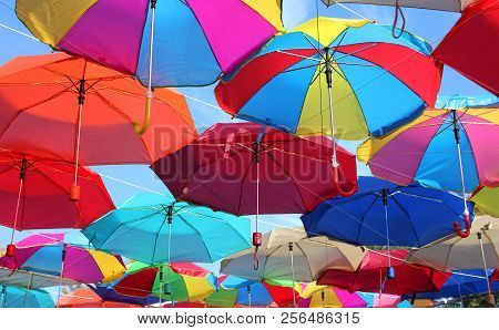 Many Colored Umbrellas On The Street. Art In The City.