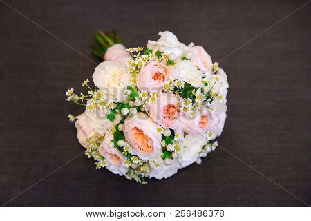 Wedding Pions Bouquet Lies On The Bed