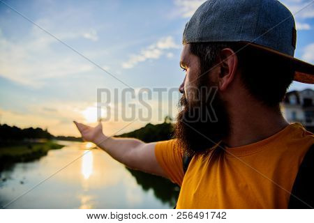 Take Moment To Admire Sunset Nature Beauty. River Sun Reflection. Man In Cap Enjoy Sunset While Stan