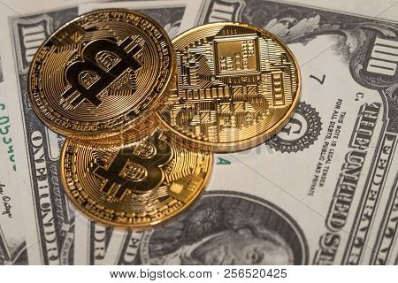 Gold Bitcoin Coins And Paper American Dollars.