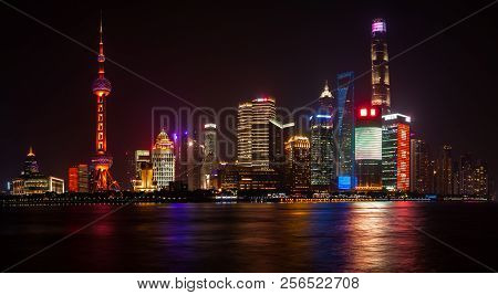 Panoramic Night View Of The New Modern District Of Shanghai Pudong From The Embankment Of The Waitan