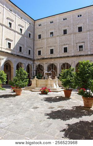 Courtyard With Fountain And Greenery In The Abbey Of Monte Cassino