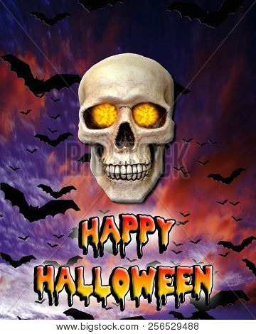 Halloween Photo Of A Skull With Fire In Its Eyes With Flying Bats At Dusk And Melting Words Of Happy