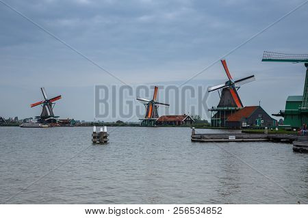 Zaanse Schans, Netherlands, August 19, 2015 - Traditional, Authentic Dutch Windmills At The River Za
