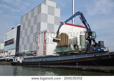 Zaanse Schans, Netherlands, August 19, 2015 - Industrial Area With Old Building, Boat And Crane.