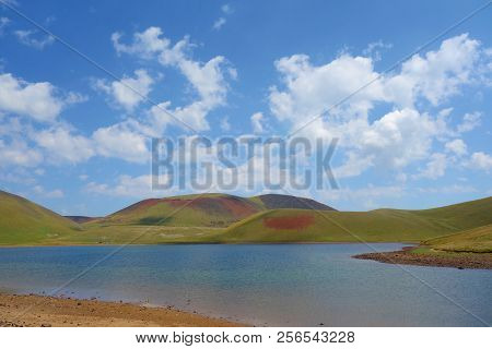 Lake Akna Surrounded By Geghama Mountains On A Hiking Trail Leading From Azhdahak Volcano In Armenia