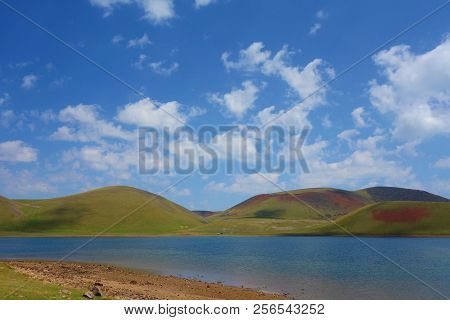 Lake Akna Surrounded By Geghama Mountains On A Hiking Trail Leading From Azhdahak Volcano In Armenia