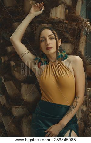 Fashionable Woman Portrait Posing On Palm Tree Steam